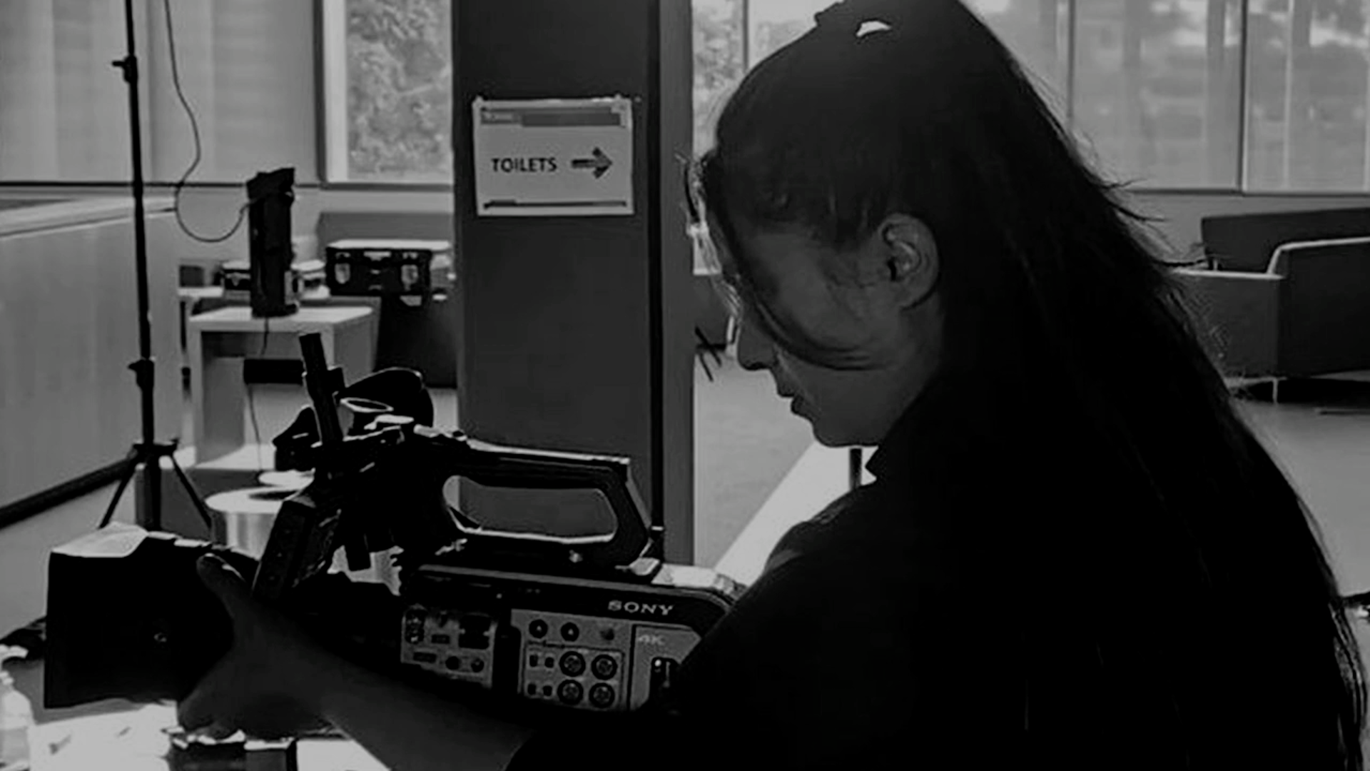 Woman with film studio camera